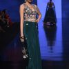 Bottle Green Dhoti Skirt And Choli With Multi Colored Hand Embroidery In Floral Motifs