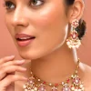 1011-white-kundan-pendant-drop-necklace-and-floral-danglers-set-1.webp White Kundan Pendant Drop Necklace and Floral Danglers Set