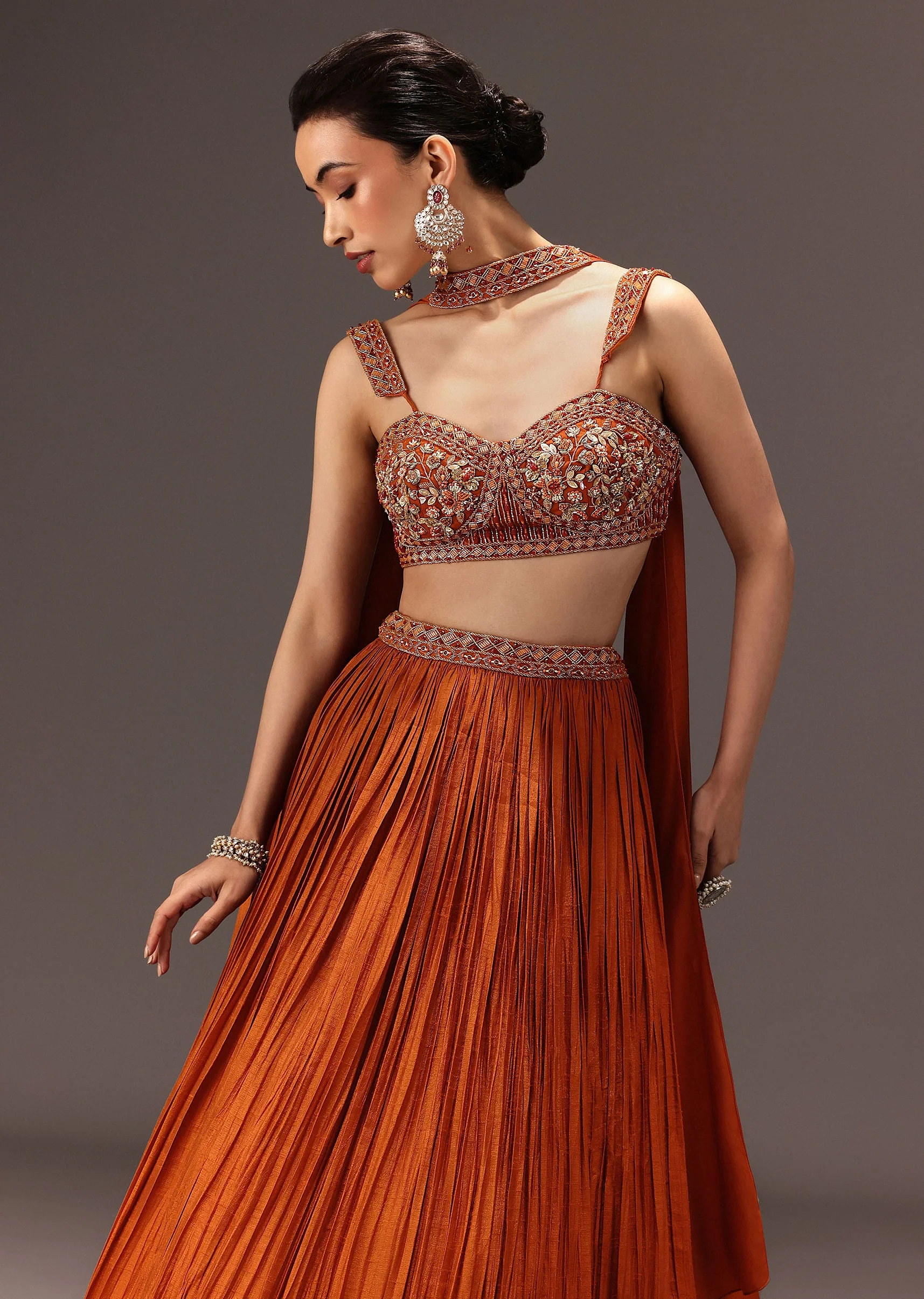 10931-burnt-rust-organza-hand-embellished-ruched-lehenga-set-with-choker-dupatta-1.webp Burnt Rust Organza Hand Embellished Ruched Lehenga Set With Choker Dupatta