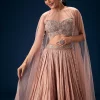 11043-peach-ruched-lehenga-with-embroidered-blouse-and-net-cape-2.webp Peach Ruched Lehenga With Embroidered Blouse and Net Cape