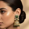 Gold Tone Jhumka Earrings With Green And Pink Stone and Pearl Detailing