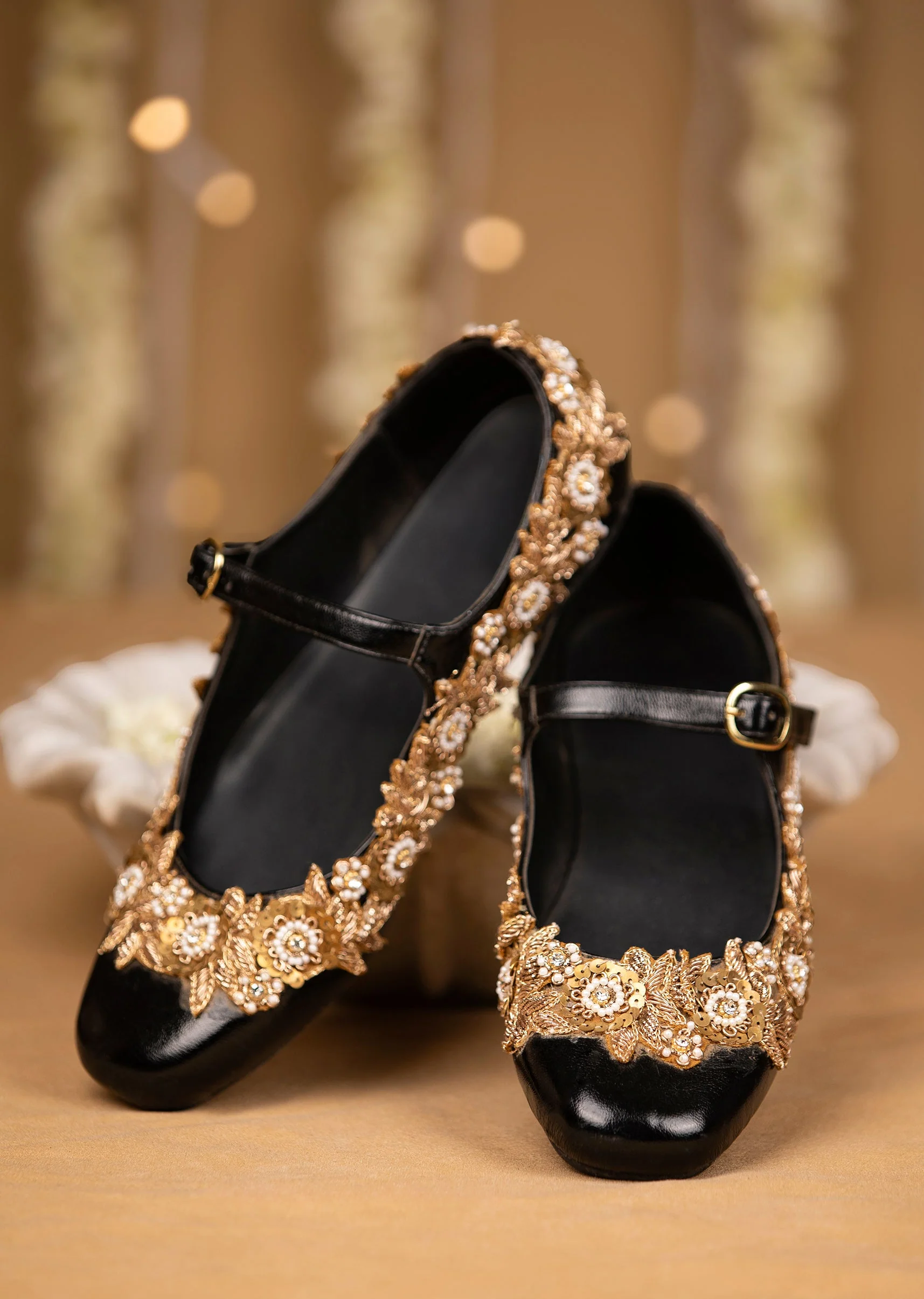 11903-black-floral-pearl-embellished-juttis-1.webp Black Floral Pearl Embellished Juttis