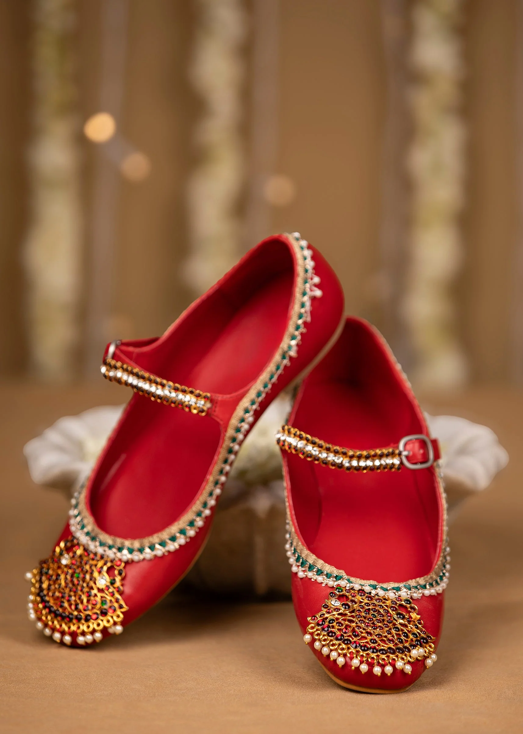 Red Kundan Faux Leather Embellished Juttis