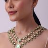 White Layered Kundan Necklace And Earring Set With Carved Motif