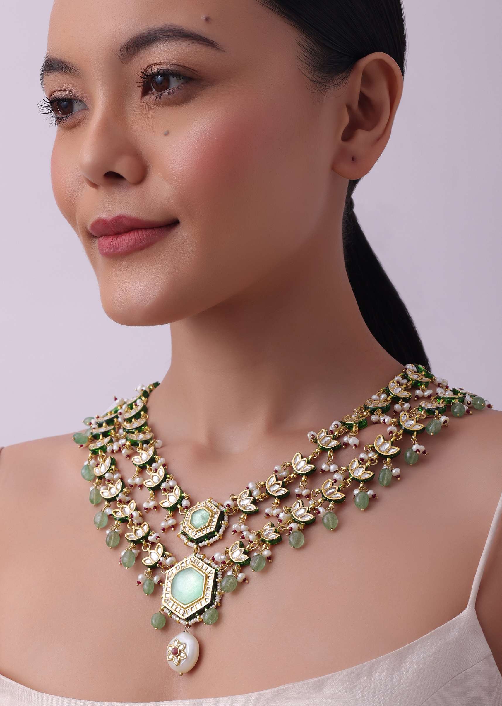 White Layered Kundan Necklace And Earring Set With Carved Motif