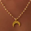 12231-gold-necklace-with-crescent-pendant-and-pearl-chain-1.webp Gold Necklace With Crescent Pendant And Pearl Chain