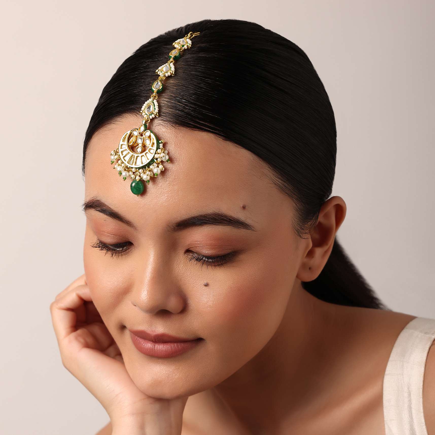12260-gold-finish-crescent-mangtikka-with-pearl-and-green-drops-1.jpg Gold Finish Crescent Mangtikka With Pearl And Green Drops