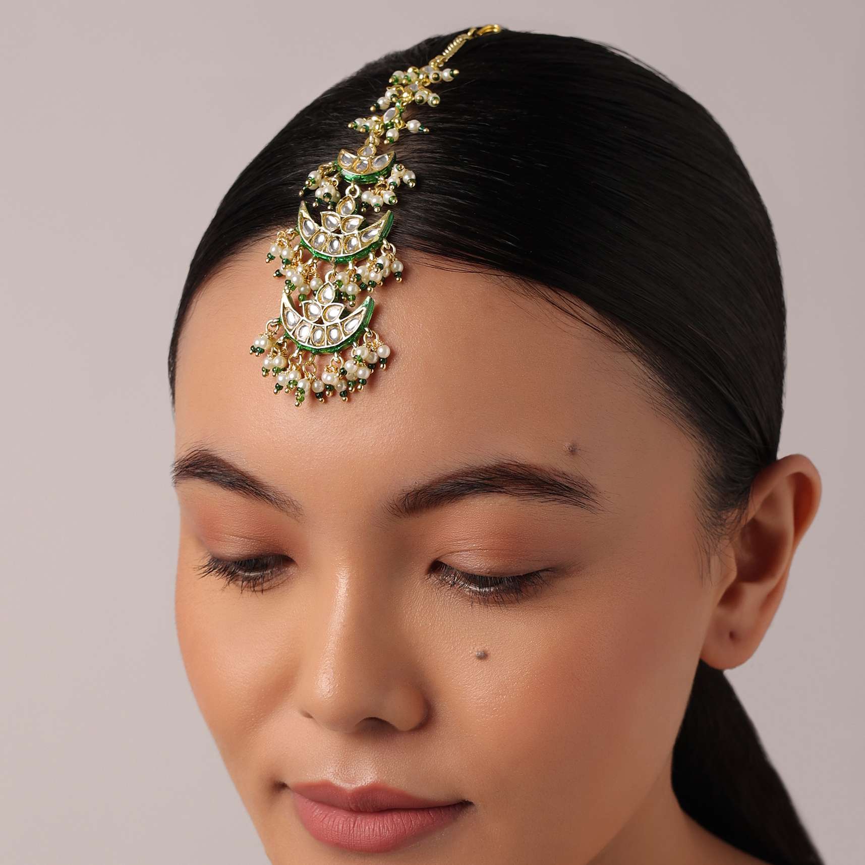 12264-green-tiered-maangtikka-with-studded-kundan-and-crescent-moon-motifs-1.jpg Green Tiered Maangtikka With Studded Kundan And Crescent Moon Motifs