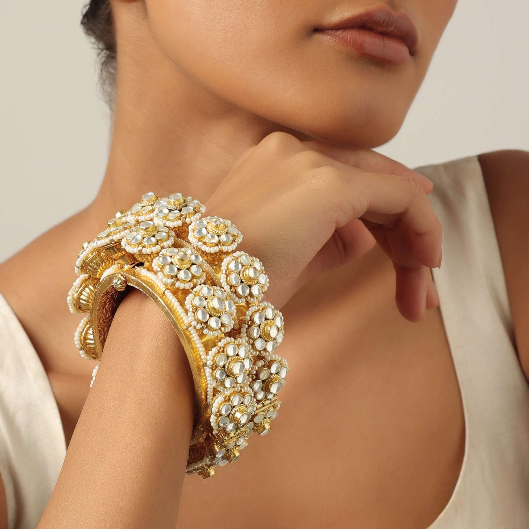 12269-gold-tone-kundan-bangle-with-pearls-and-floral-motifs-3.jpg Gold Tone Kundan Bangle With Pearls And Floral Motifs