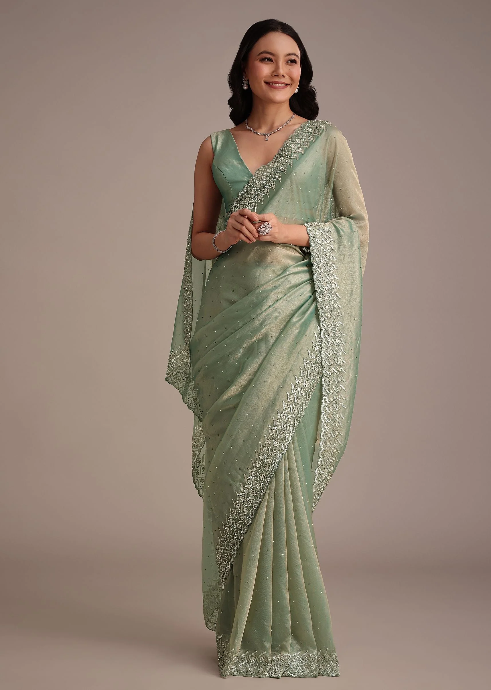 13468-sea-green-tissue-saree-with-cutdana-and-stone-embroidery-1.webp Sea Green Tissue Saree With Cutdana And Stone Embroidery