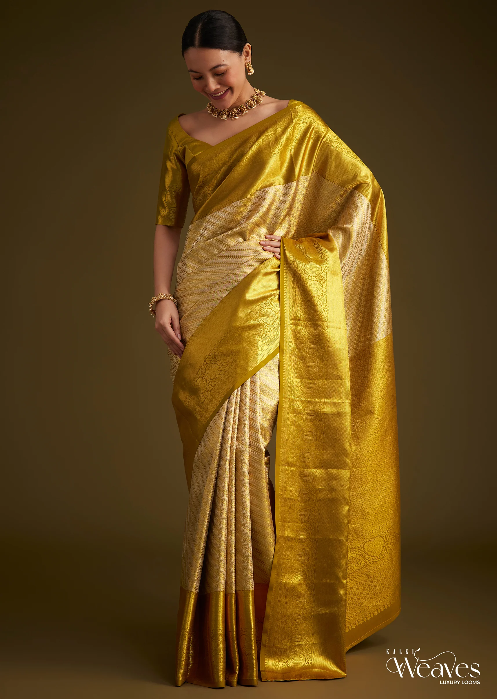 13670-gold-kanjivaram-silk-saree-with-zari-border-1.webp Gold Kanjivaram Silk Saree With Zari Border