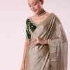 Silver Zari Tissue Saree With Embroidered Emerald Green Stitched Blouse
