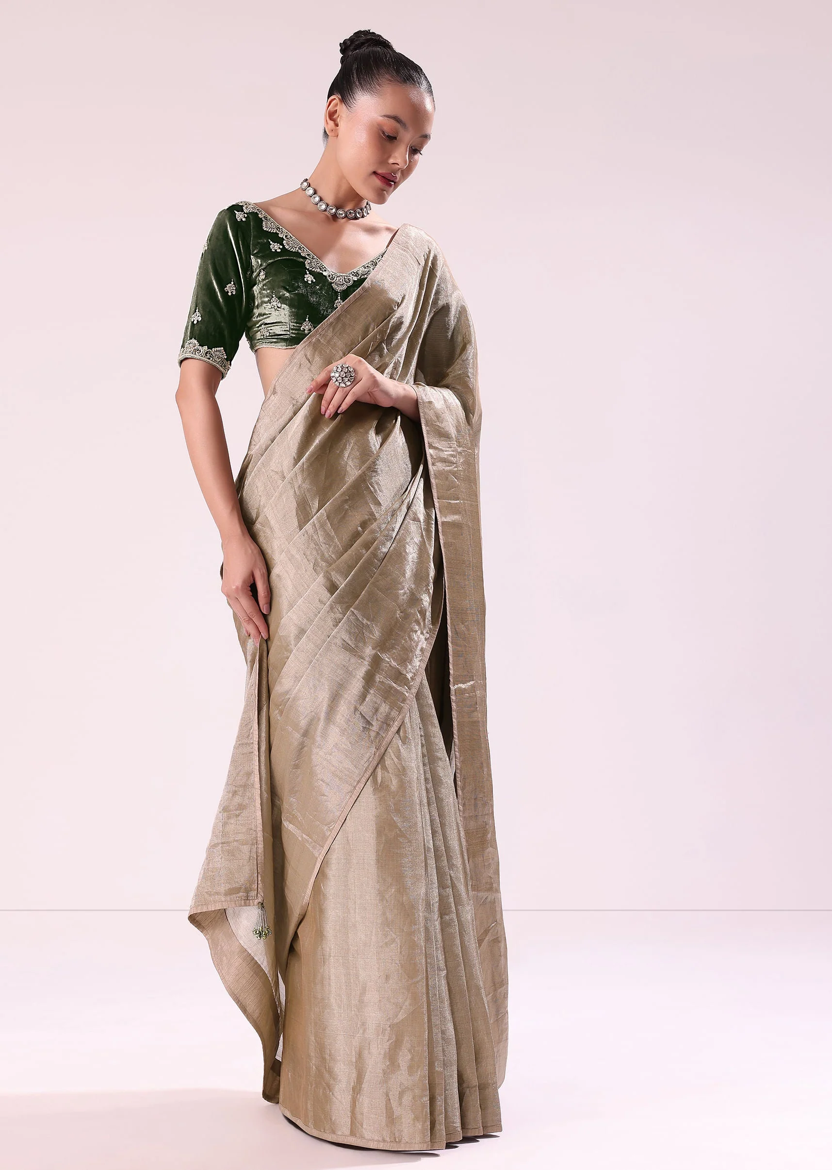 Silver Zari Tissue Saree With Embroidered Emerald Green Stitched Blouse