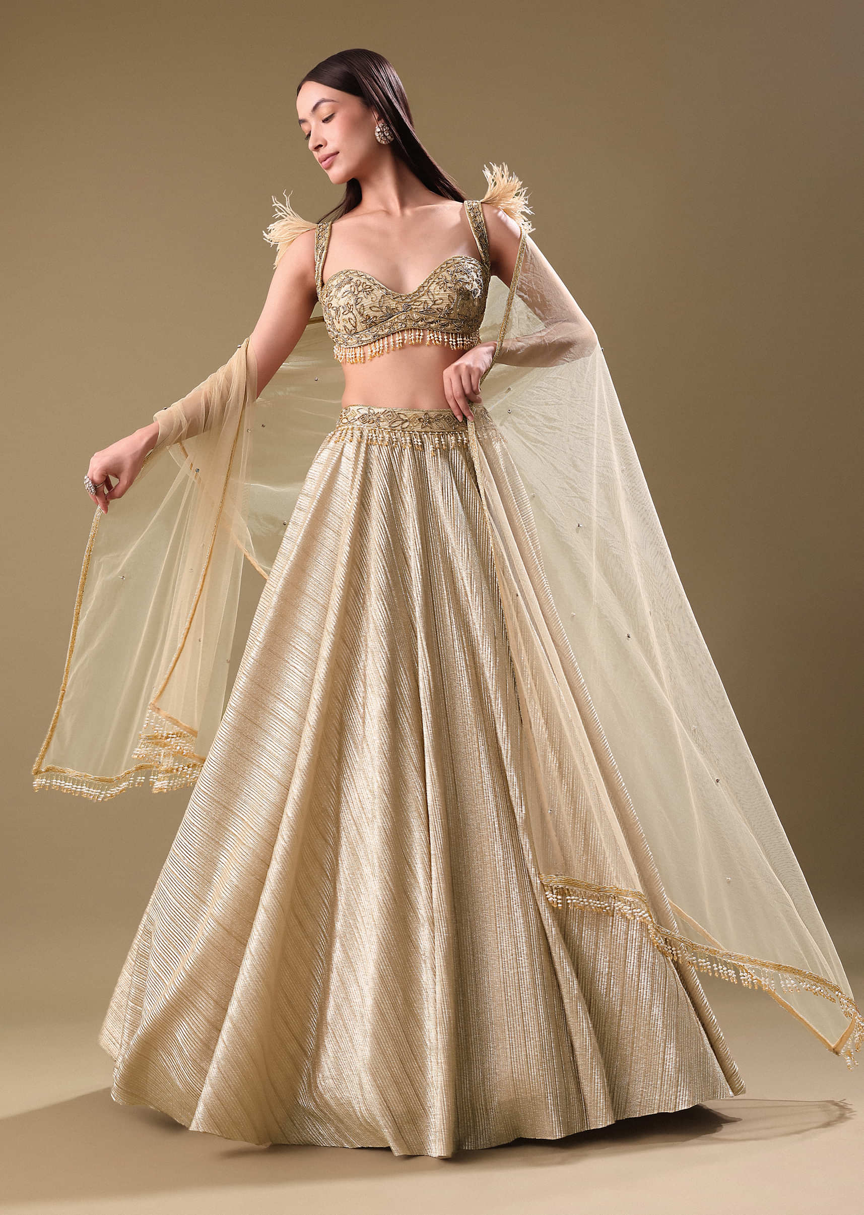 14921-gold-pre-pleated-lehenga-with-embellished-blouse-and-net-dupatta-1.jpg Gold Pre Pleated Lehenga With Embellished Blouse And Net Dupatta