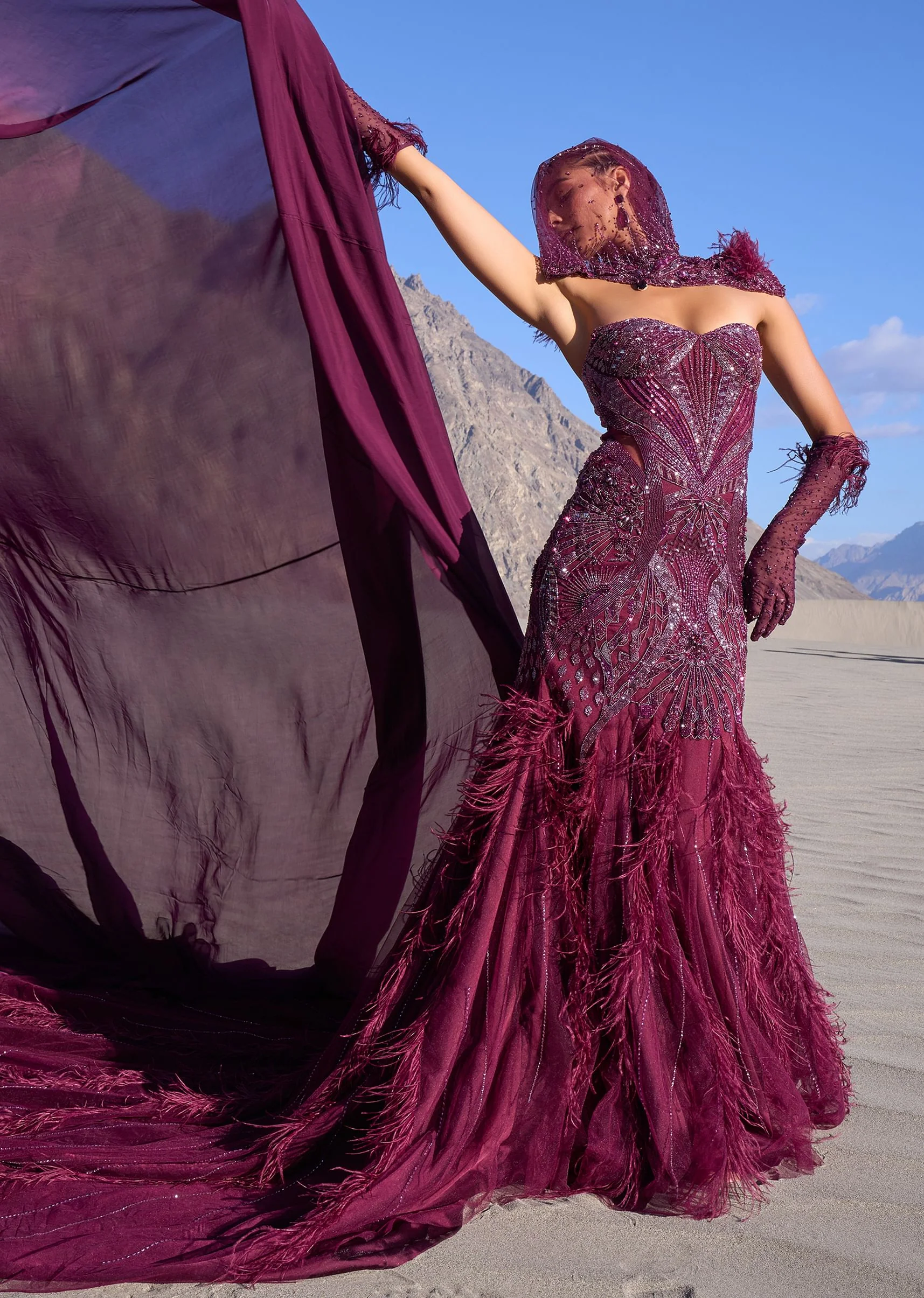 15298-wine-mermaid-feather-trail-gown-with-embroidered-gloves-and-veil-1.webp Wine Mermaid Feather Trail Gown With Embroidered Gloves And Veil
