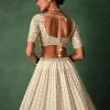 Ivory Raw Silk Hand Embroidered Lehenga Set In Cutdana Work