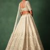 Ivory Raw Silk Hand Embroidered Lehenga Set In Cutdana Work