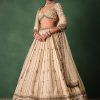 15674-ivory-raw-silk-hand-embroidered-lehenga-set-with-net-dupatta-1.jpg Ivory Raw Silk Hand Embroidered Lehenga Set With Net Dupatta