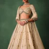 15674-ivory-raw-silk-hand-embroidered-lehenga-set-with-net-dupatta-2.webp Ivory Raw Silk Hand Embroidered Lehenga Set With Net Dupatta