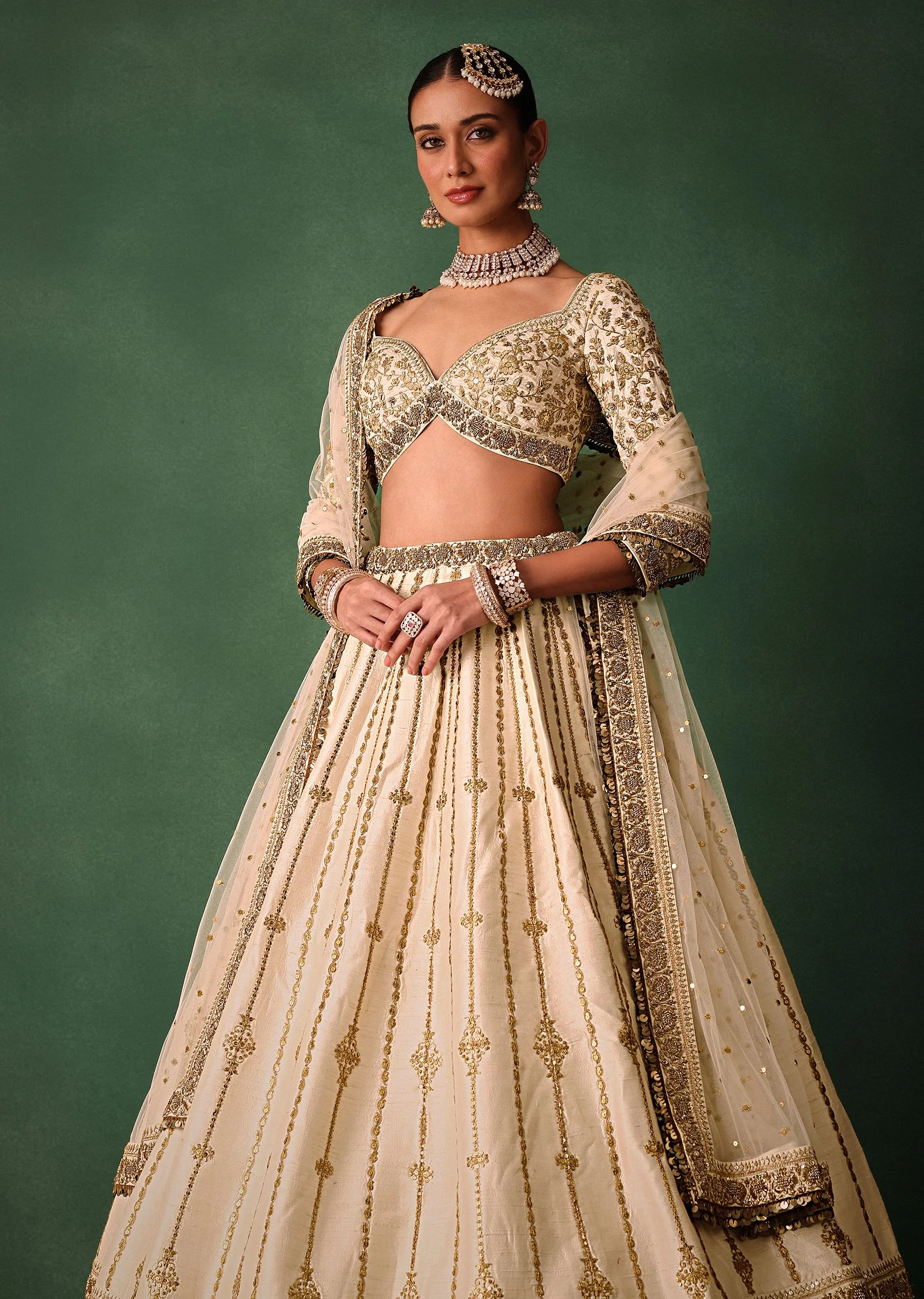 15674-ivory-raw-silk-hand-embroidered-lehenga-set-with-net-dupatta-2.webp Ivory Raw Silk Hand Embroidered Lehenga Set With Net Dupatta