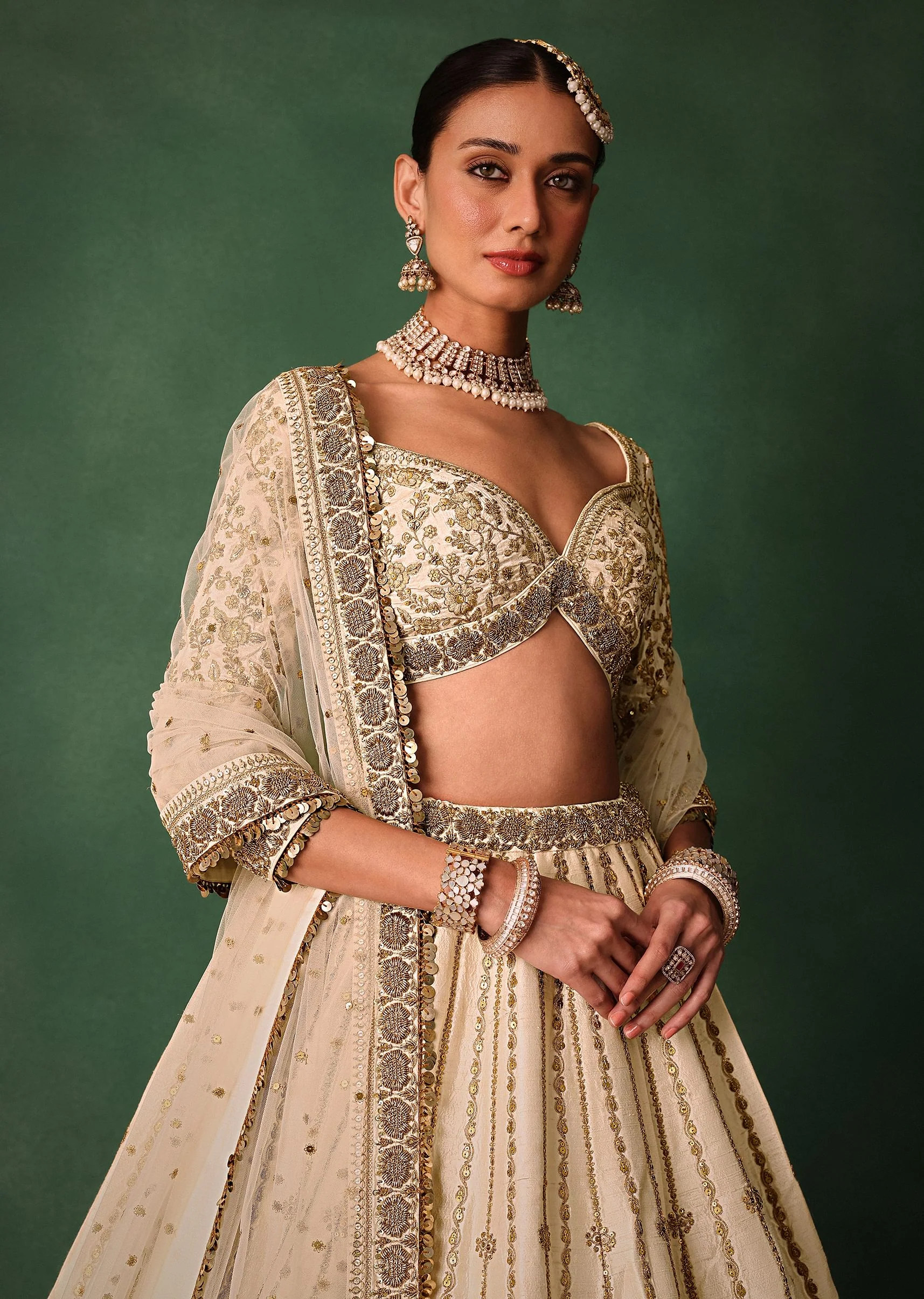 15674-ivory-raw-silk-hand-embroidered-lehenga-set-with-net-dupatta-4.webp Ivory Raw Silk Hand Embroidered Lehenga Set With Net Dupatta