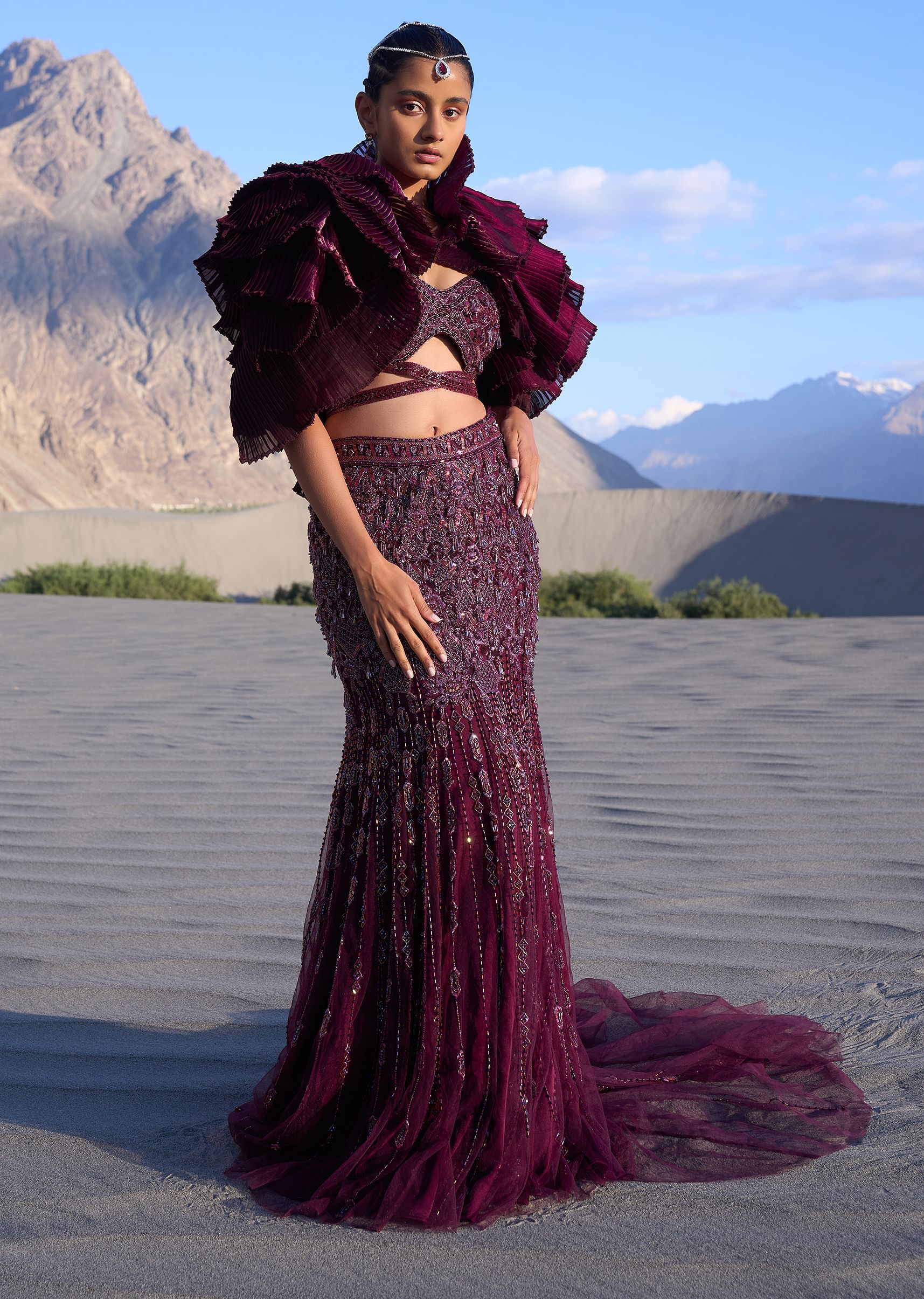 16048-wine-ruffle-embroidered-fish-cut-lehenga-with-long-trail-and-jacket-1.jpg Wine Ruffle Embroidered Fish Cut Lehenga With Long Trail And Jacket