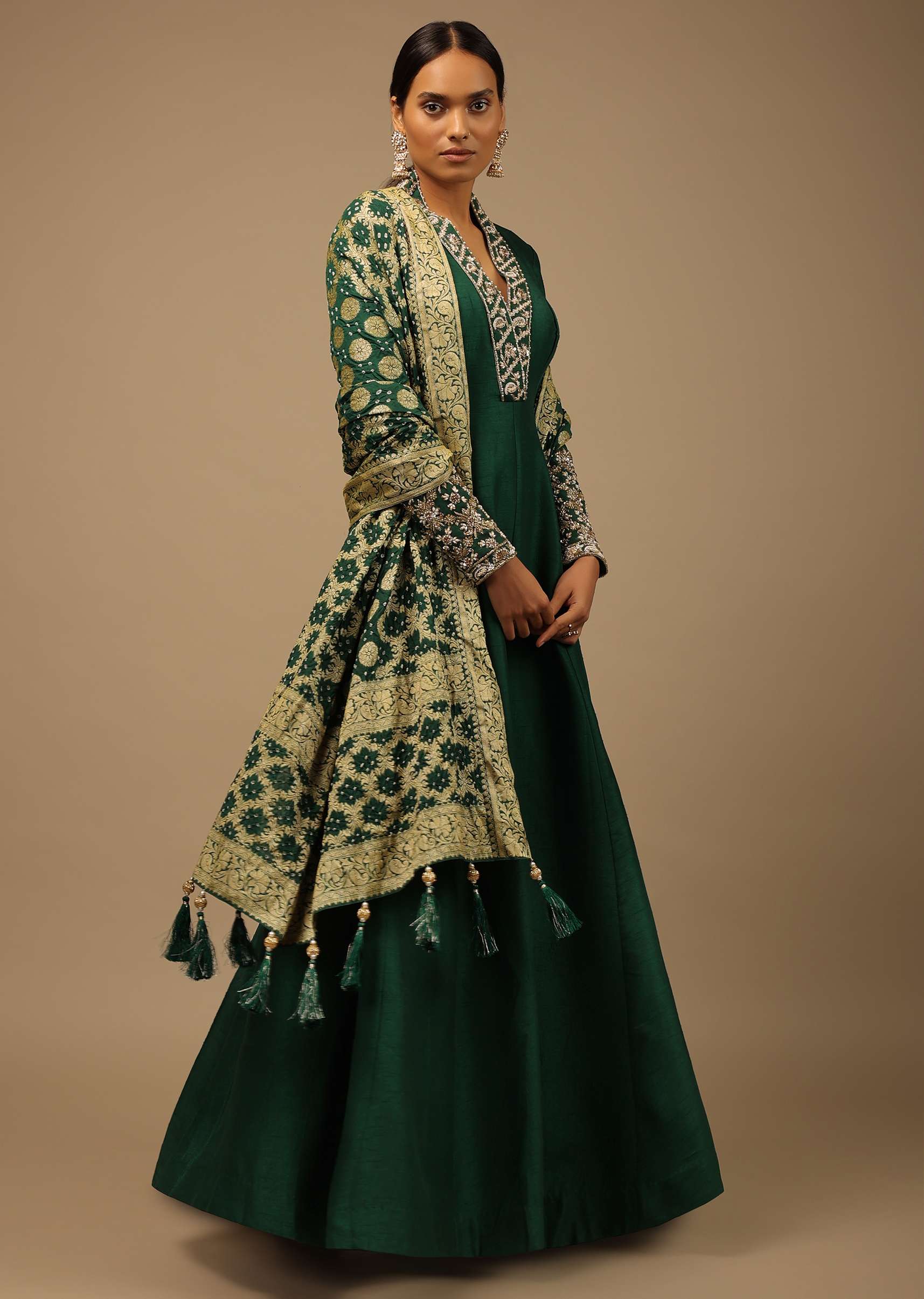 18520-bottle-green-anarkali-suit-in-raw-silk-with-hand-embroidery-and-a-brocade-dupatta-enhanced-with-bandhani-1.jpg Bottle Green Anarkali Suit In Raw Silk With Hand Embroidery And A Brocade Dupatta Enhanced With Bandhani
