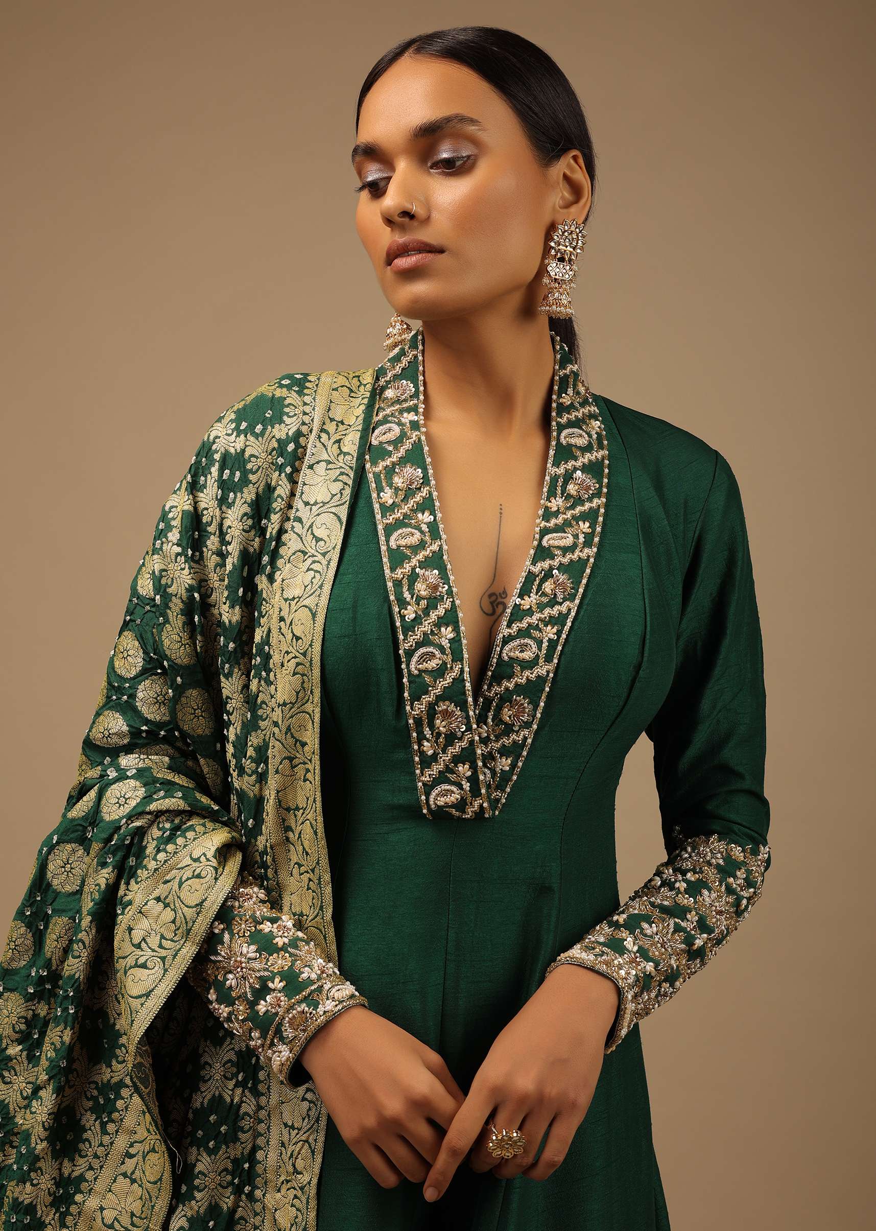 Bottle Green Anarkali Suit In Raw Silk With Hand Embroidery And A Brocade Dupatta Enhanced With Bandhani