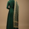 Bottle Green Anarkali Suit In Raw Silk With Hand Embroidery And A Brocade Dupatta Enhanced With Bandhani