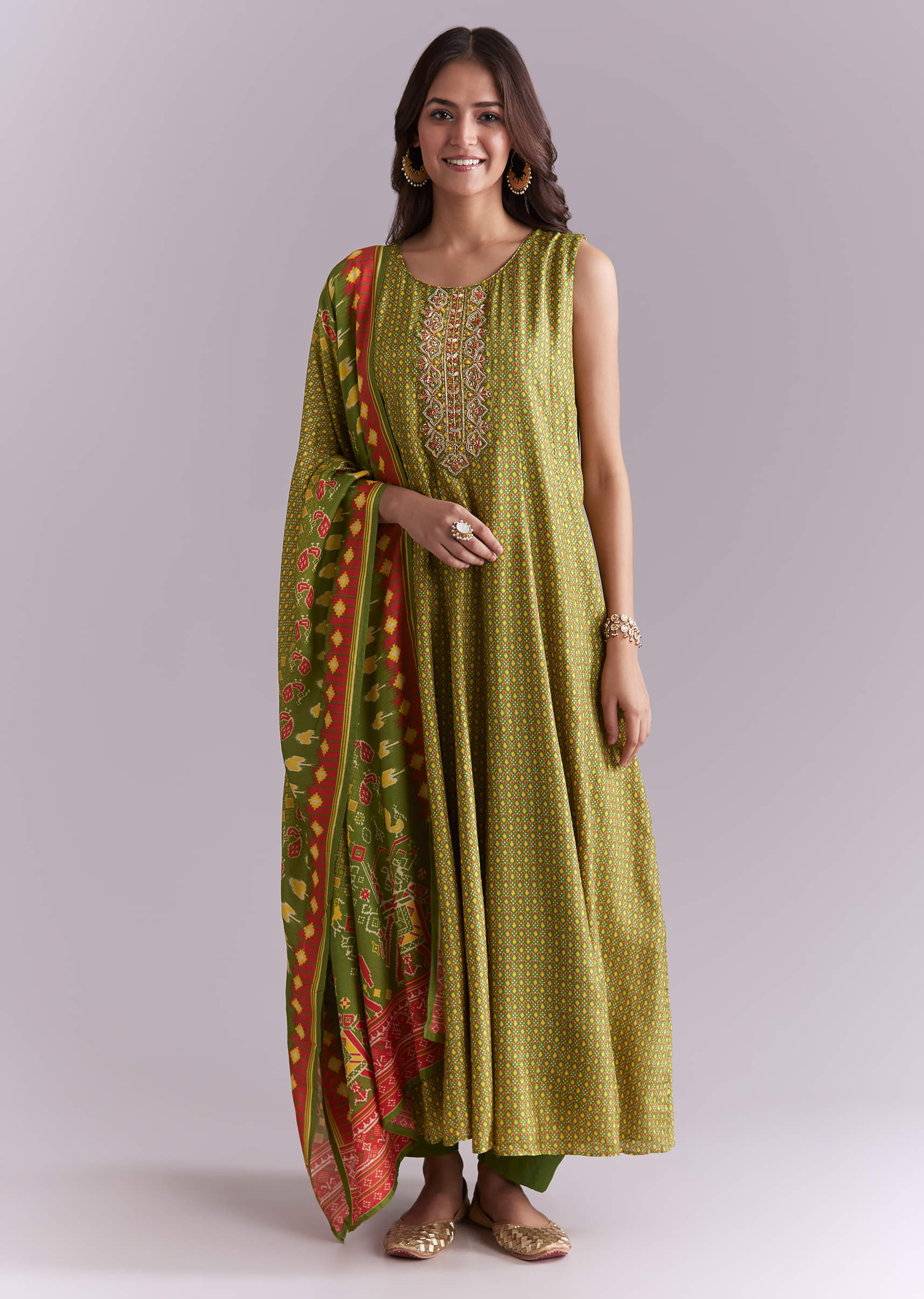 19572-green-muslin-anarkali-suit-with-patola-style-print-1.jpg Green Muslin Anarkali Suit With Patola Style Print