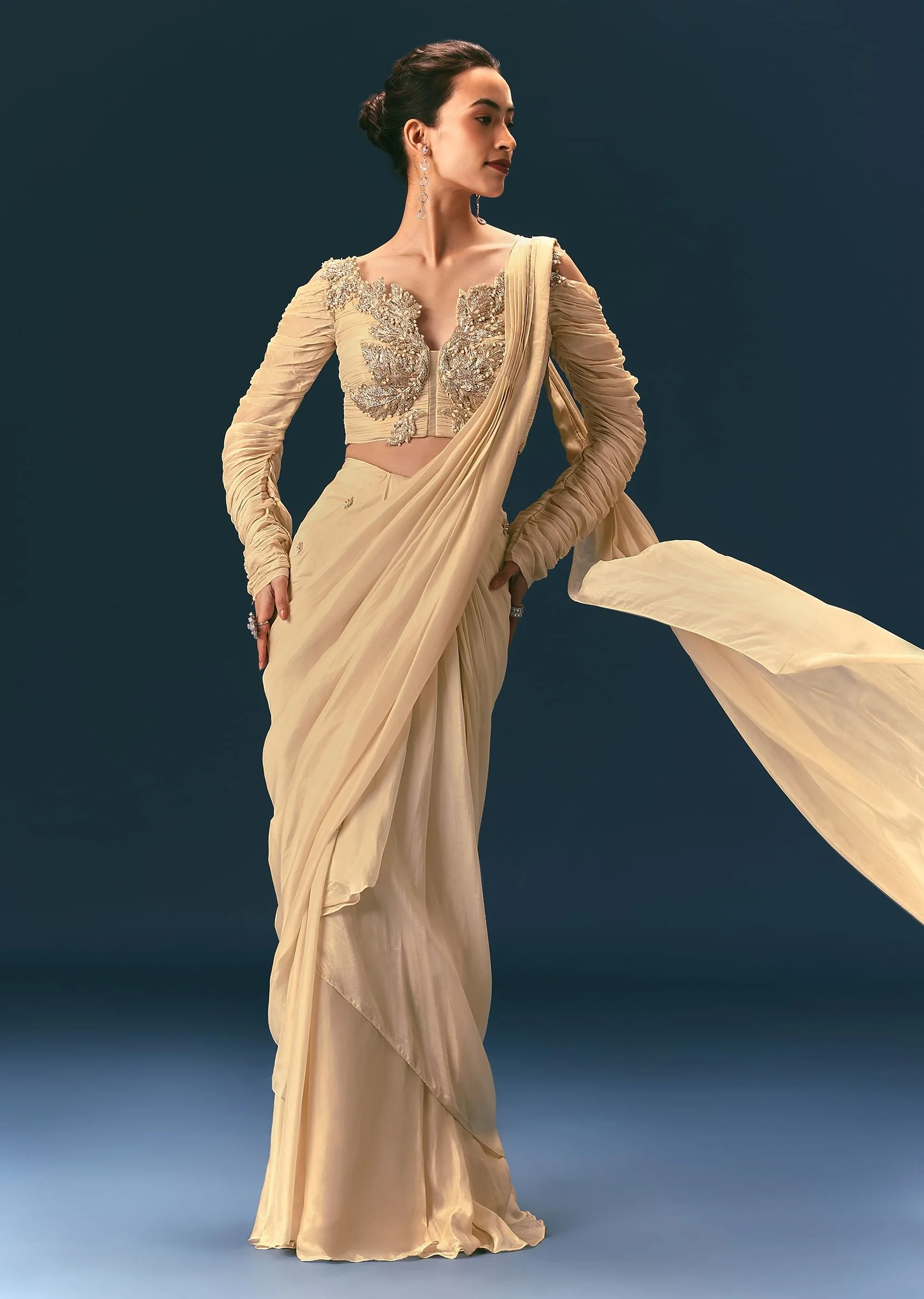 2011-champagne-peach-embroidered-draped-saree-with-3d-applique-blouse-1.webp Champagne Peach Embroidered Draped Saree With 3D Applique Blouse
