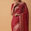 Red Banarasi Georgette Saree With Bandhani Weave And Unstitched Blouse Piece
