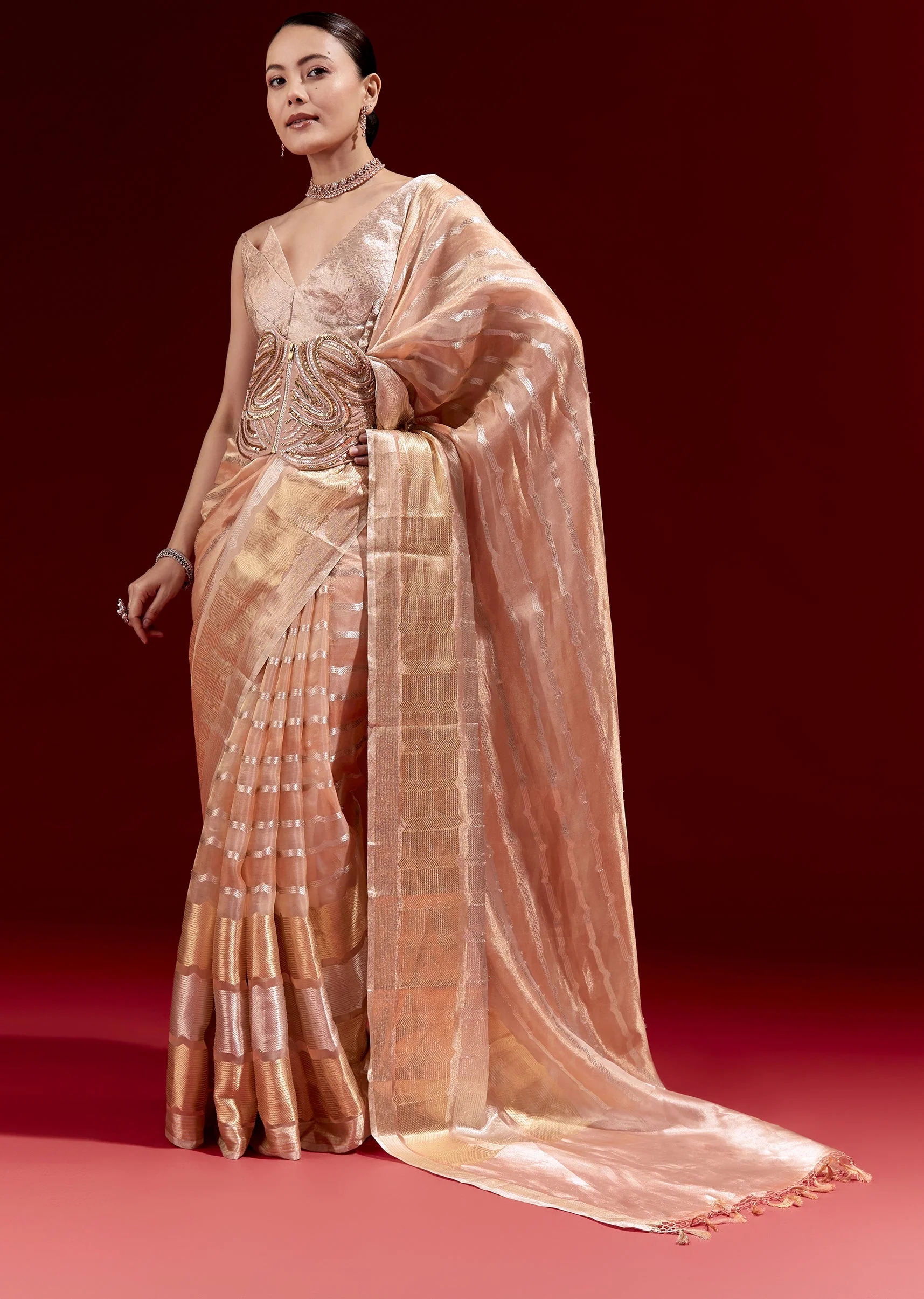 21448-peach-banarasi-tissue-saree-with-chanderi-stripes-and-embroidered-cutdana-belt-1.webp Peach Banarasi Tissue Saree With Chanderi Stripes And Embroidered Cutdana Belt