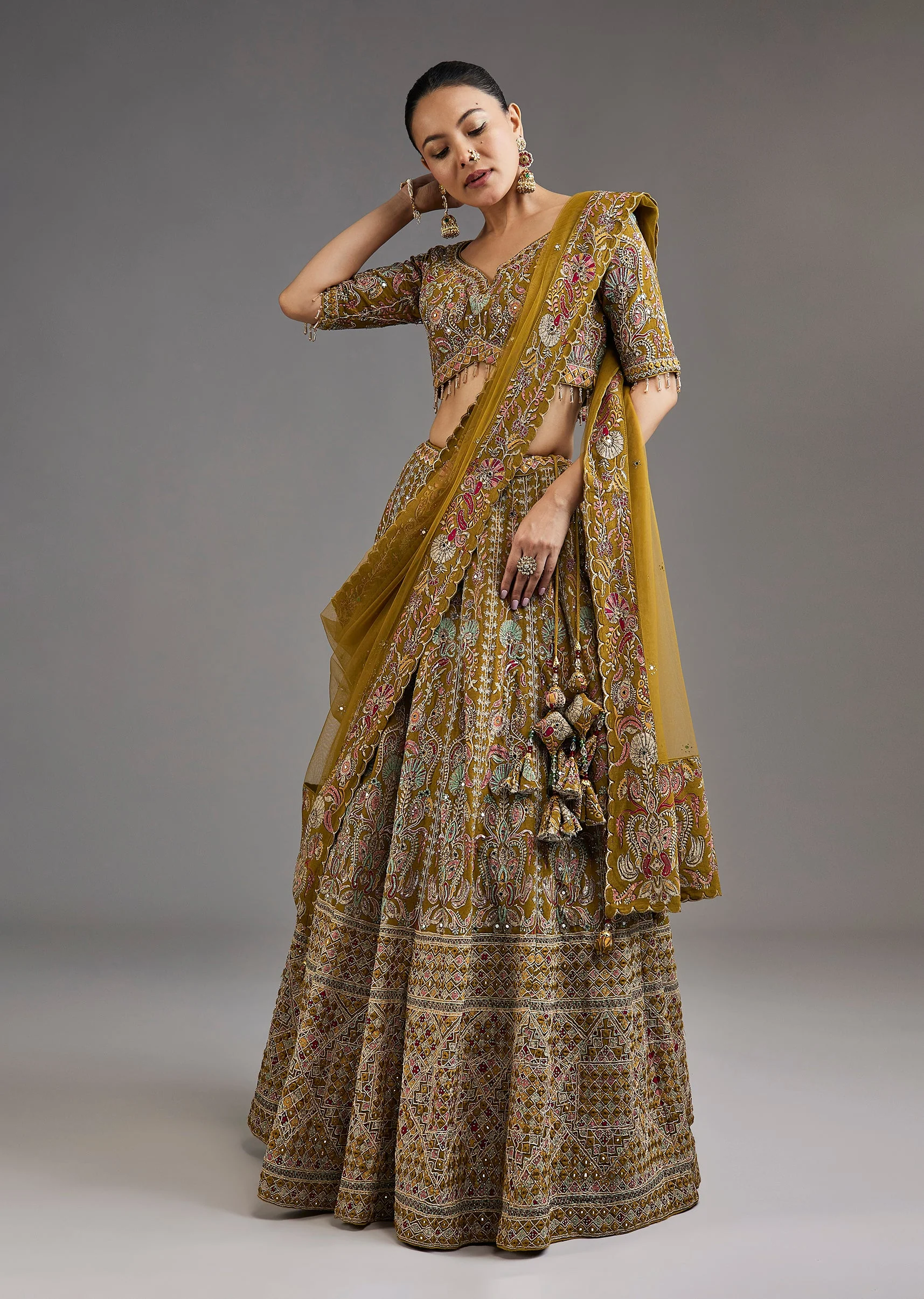 2213-mehendi-green-lehenga-with-mirror-accents-1.webp Mehendi Green Lehenga With Mirror Accents