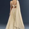 Off White Banarasi Silk Bridesmaid Lehenga With Intricate Hand Embroidery
