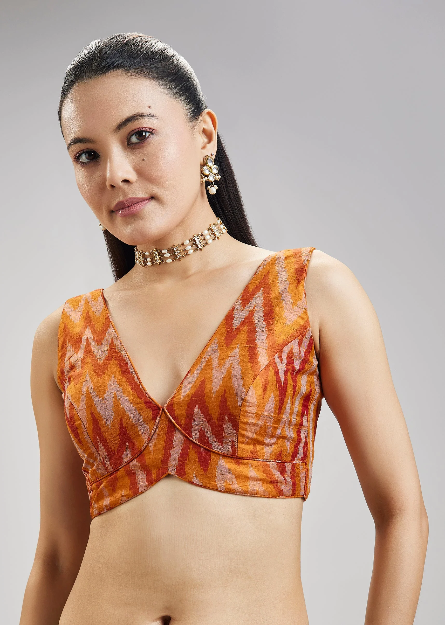 2610-rust-orange-pure-tussar-silk-ikat-potal-stitched-blouse-1.webp Rust Orange Pure Tussar Silk Ikat Potal Stitched Blouse