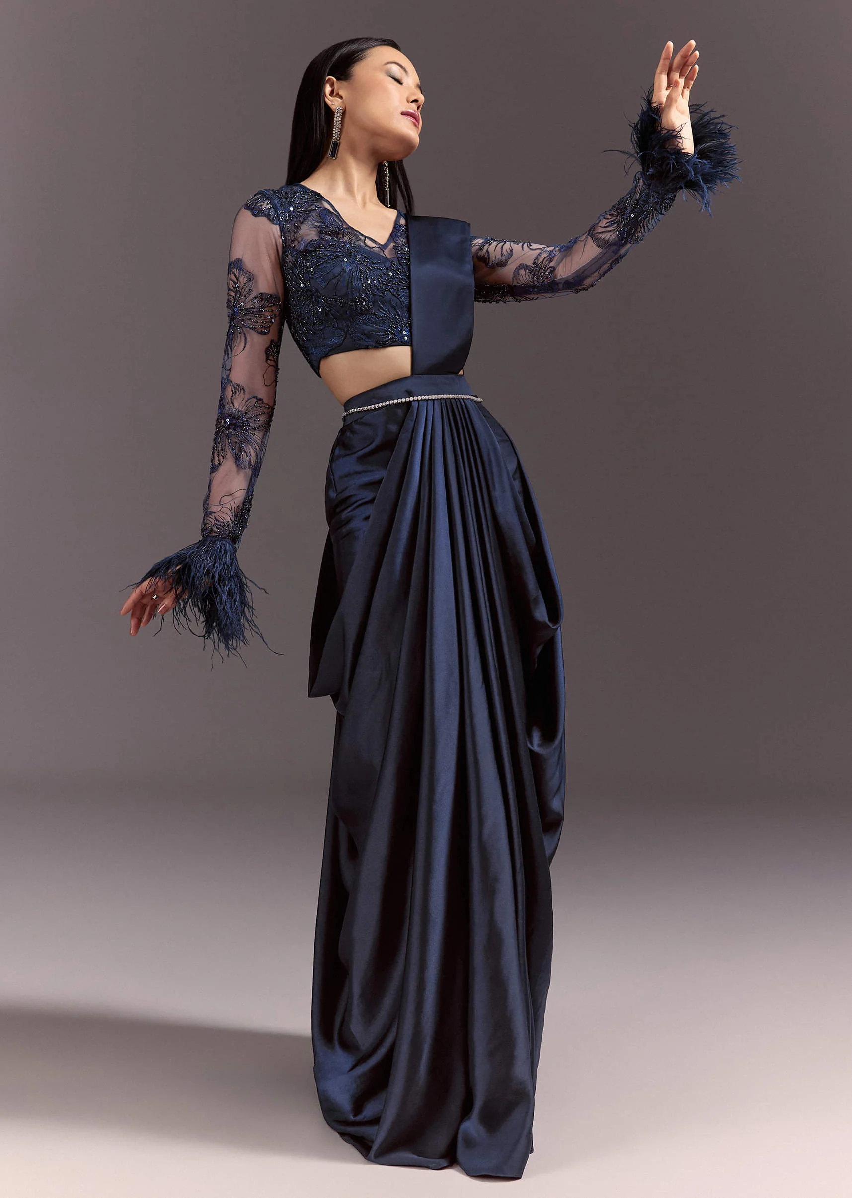 2721-navy-blue-satin-pleated-saree-with-full-sleeve-v-neck-blouse-1.webp Navy Blue Satin Pleated Saree With Full Sleeve V Neck Blouse