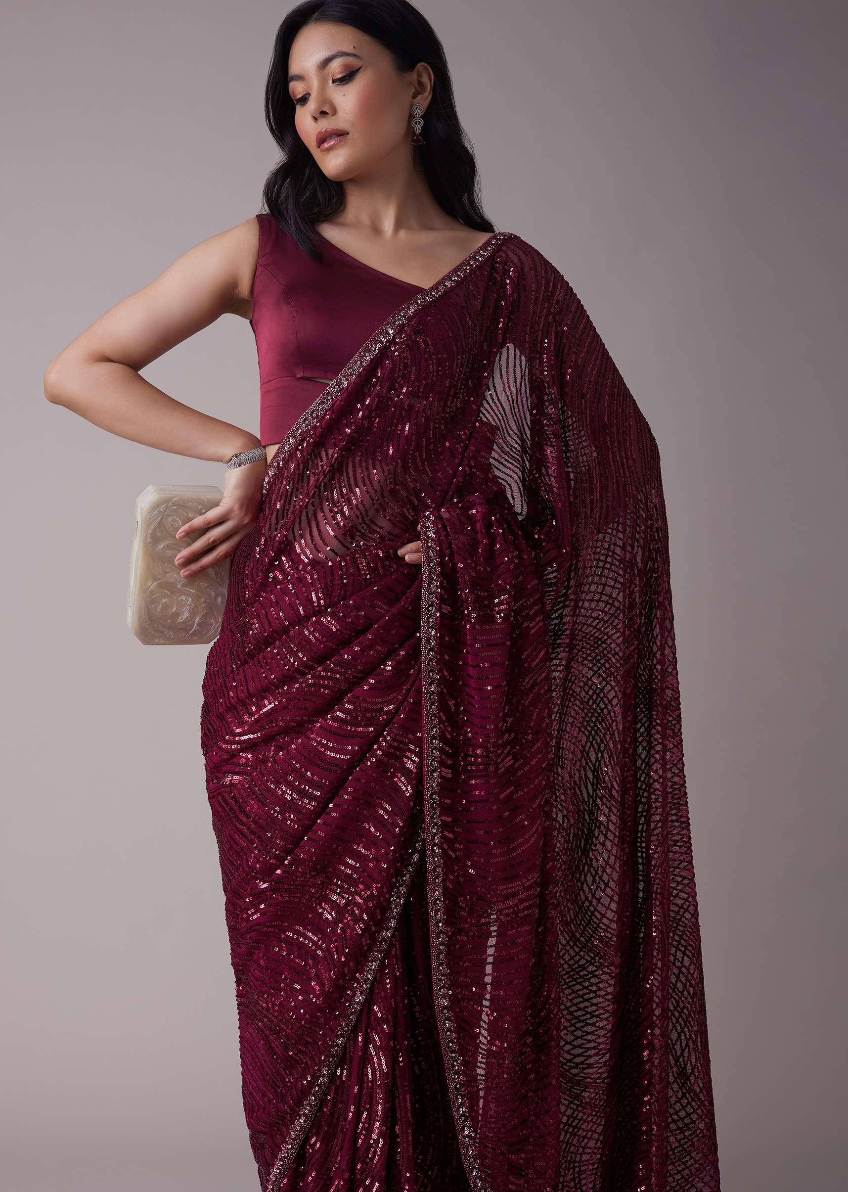 Wine Sequins Saree With An Embellished Border
