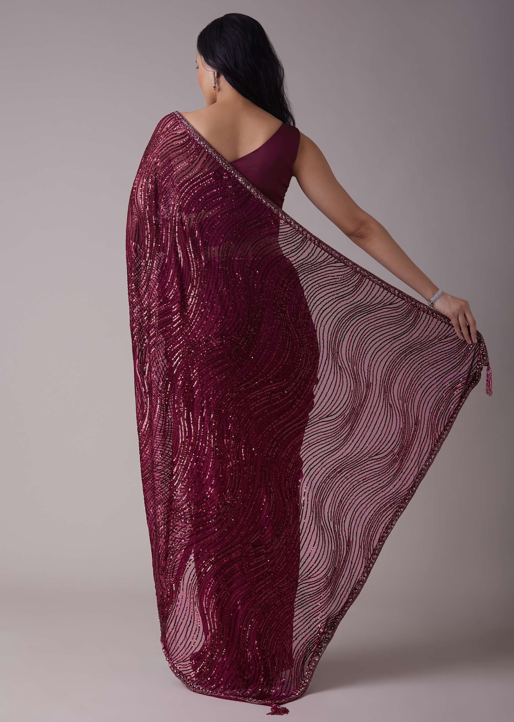 Wine Sequins Saree With An Embellished Border