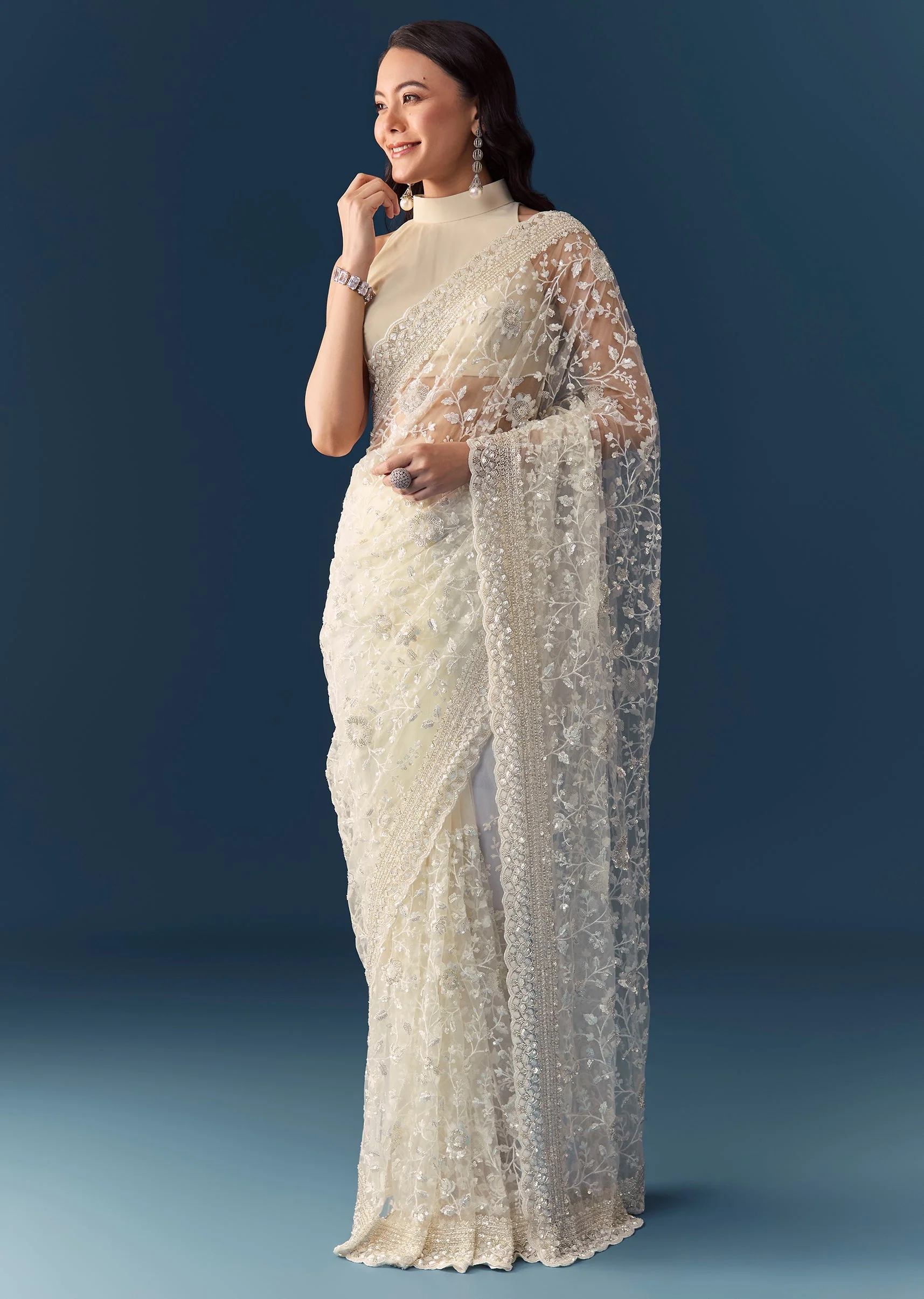 2839-cream-net-jaal-embellished-saree-with-unstitched-blouse-1.webp Cream Net Jaal Embellished Saree with Unstitched Blouse