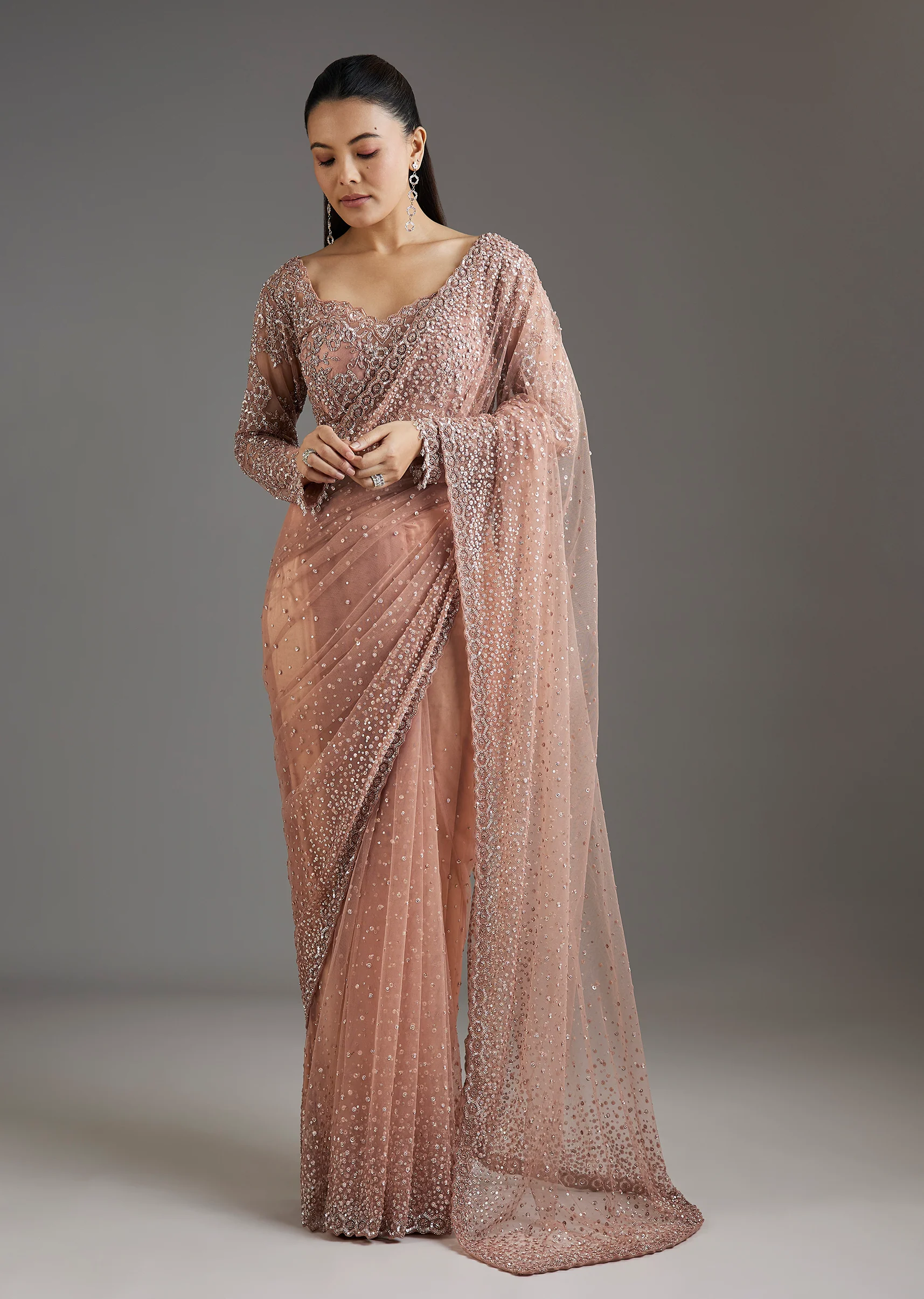 3073-peach-sequins-embellished-net-saree-with-full-sleeves-blouse-1.webp Peach Sequins Embellished Net Saree With Full Sleeves Blouse