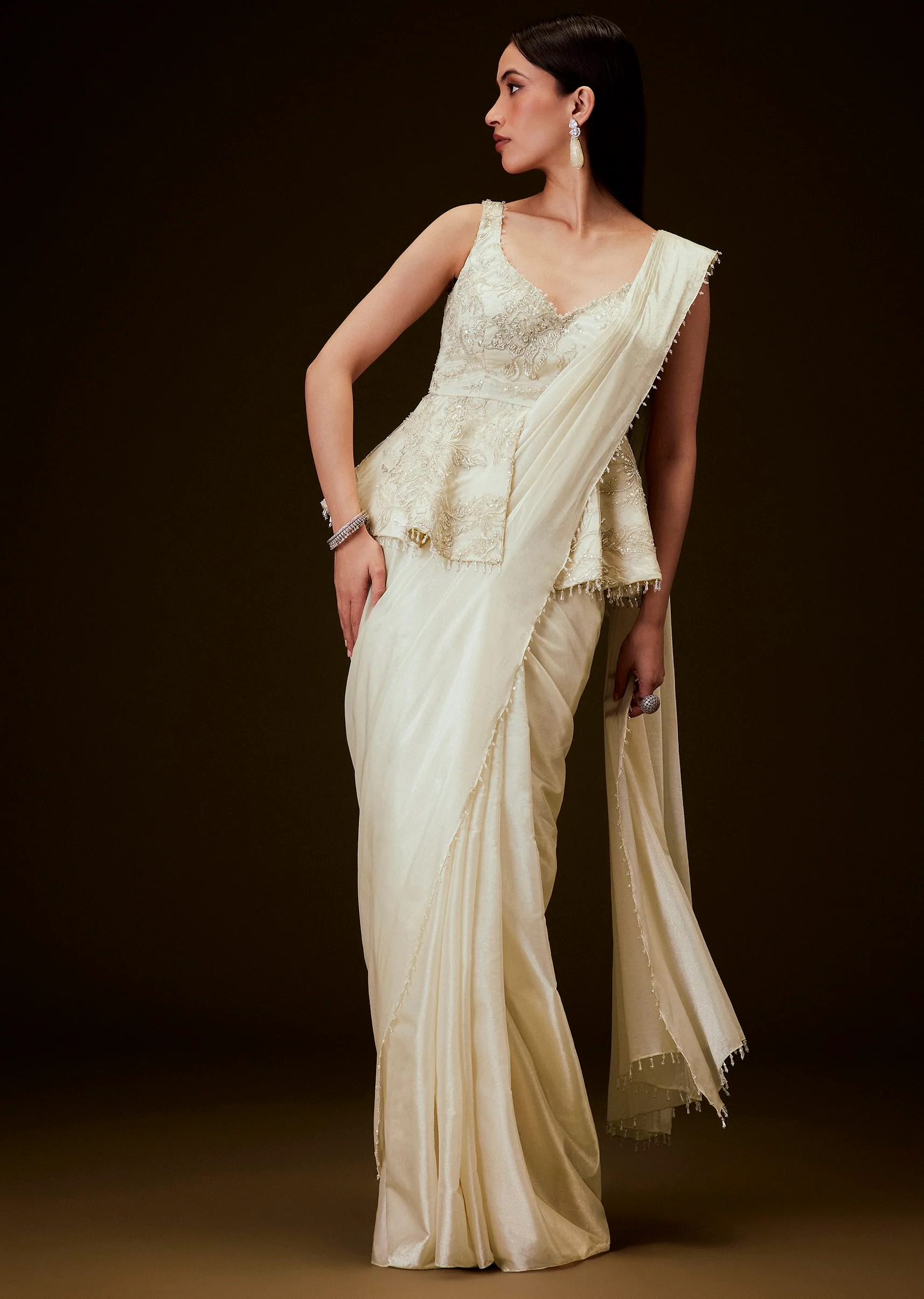 3222-ivory-embroidered-peplum-top-with-saree-1.webp Ivory Embroidered Peplum Top With Saree