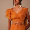 Rust Orange Saree With Fancy Ruffle Blouse And Embroidered Belt
