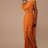 Rust Orange Saree With Fancy Ruffle Blouse And Embroidered Belt