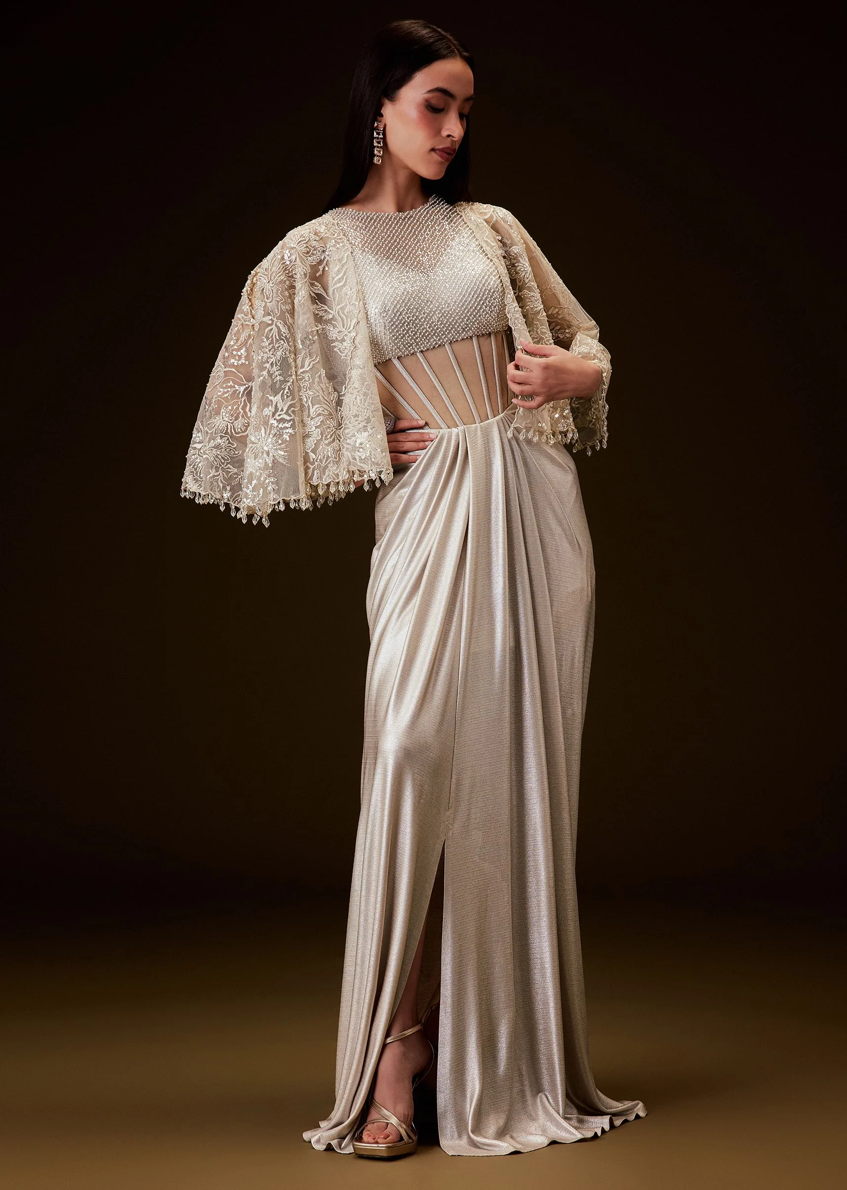 3404-off-white-corset-gown-with-sheer-waistline-and-embroidered-cape-1.webp Off White Corset Gown With Sheer Waistline And Embroidered Cape
