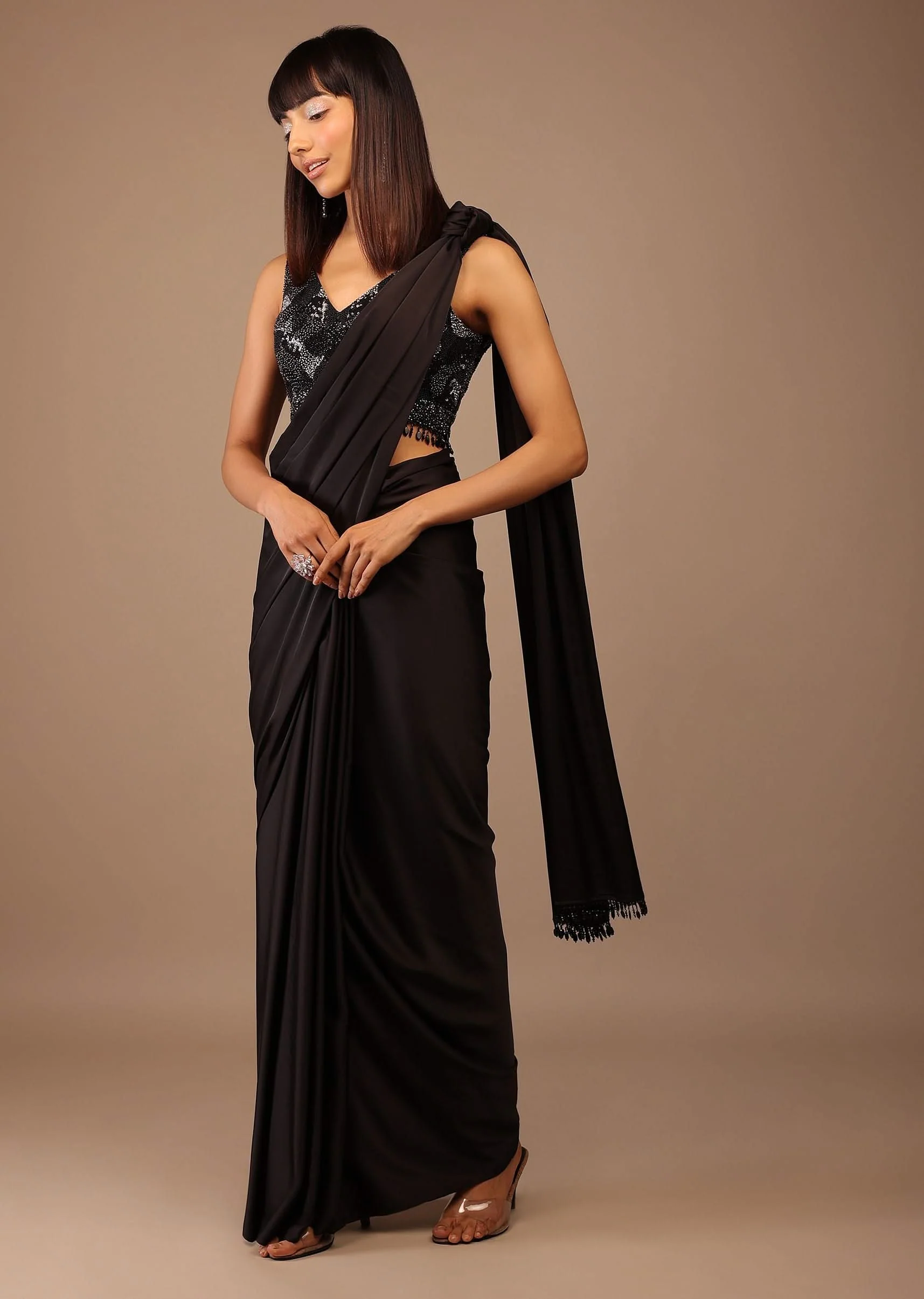 3762-black-satin-saree-with-hand-embroidered-blouse-with-fringes-on-the-hem-1.webp Black Satin Saree With Hand Embroidered Blouse With Fringes On The Hem