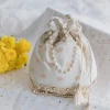 Cream Cotton Potli With Embroidery And Mirror Work