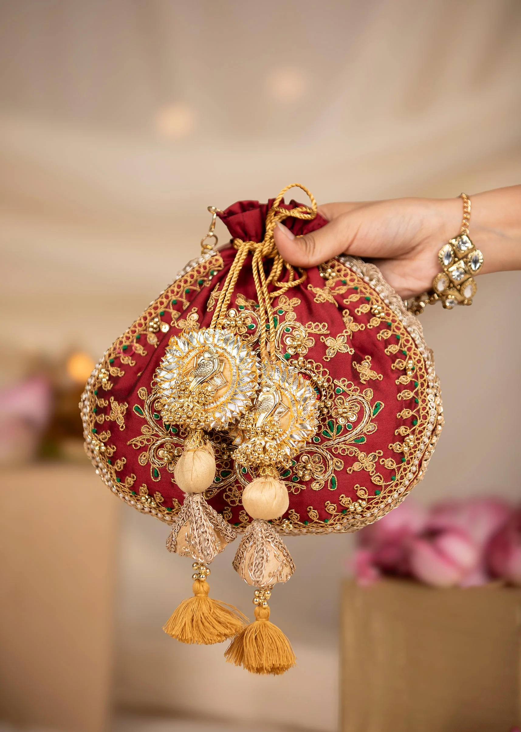 458-maroon-and-gold-silk-peacock-motif-embroidered-potli-bag-1.webp Maroon and Gold Silk Peacock Motif Embroidered Potli Bag