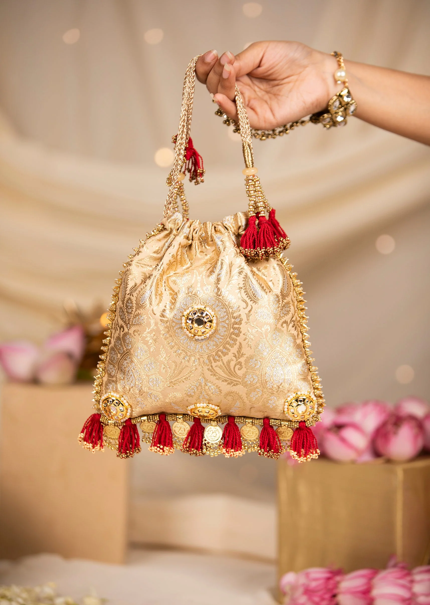 464-gold-and-red-floral-motif-kundan-embellished-potli-bag-1.webp Gold and Red Floral Motif Kundan Embellished Potli Bag