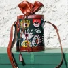 Handcrafted leather potli bag with bold colourful eye embroidery